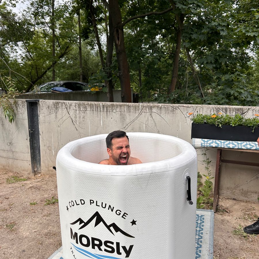 Person reacting to cold plunge ice bath at MORSly event in Warsaw Poland